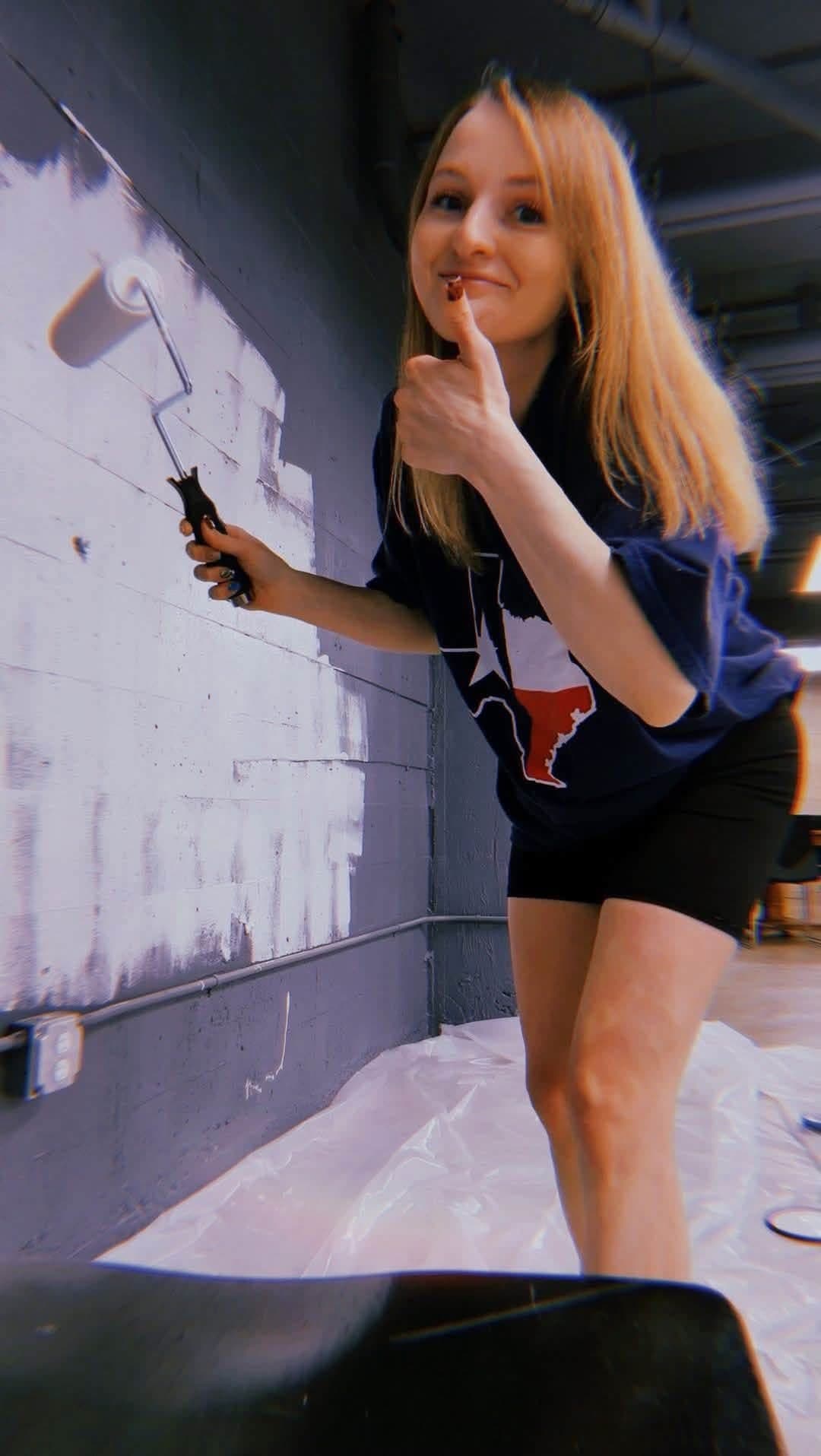 Charisma painting the walls while getting Poppy House ready